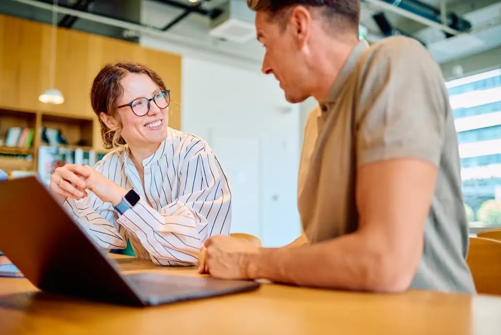 man-and-woman-talking-in-the-office