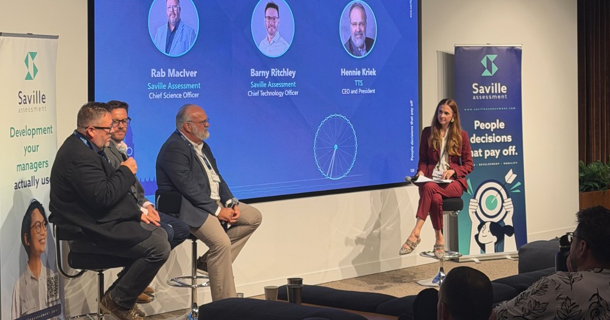 Panel on AI in talent assessment at a live Saville event in London: Rab MacIver speaking alongside Barny Ritchley, Hennie Kriek and host Hannah Mullaney
