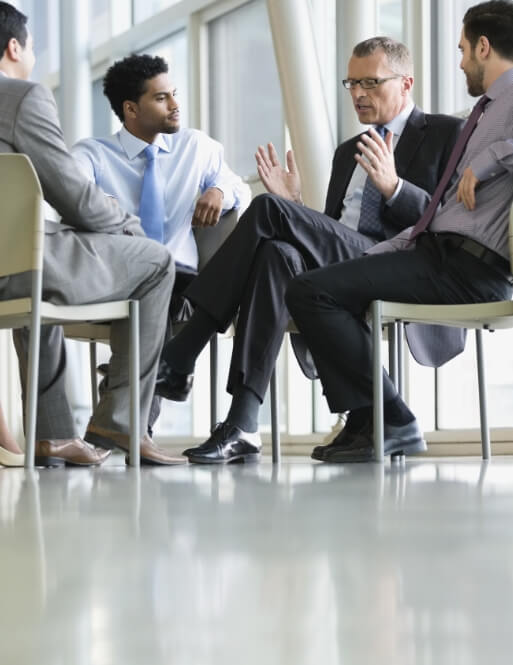 A group of colleagues sitting in a circle having a discussion