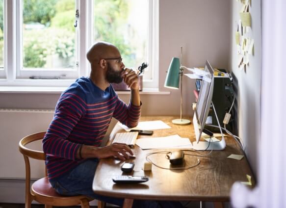 man sitting at desk