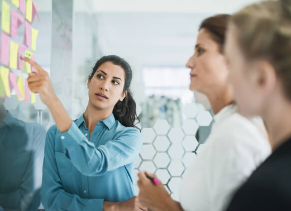 woman pointing at notes