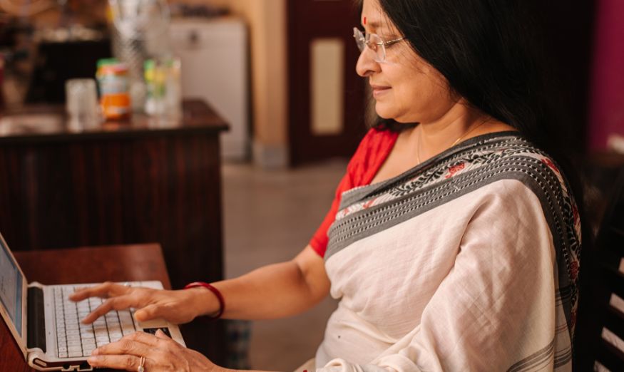 woman typing on a laptop keyboard