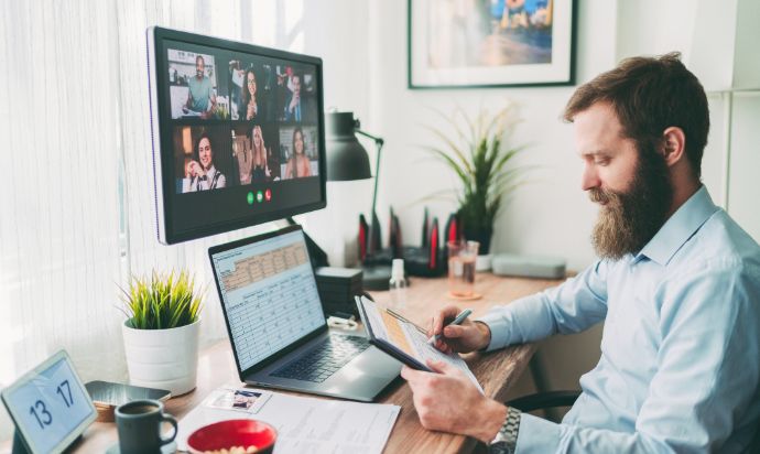 man using tablet whilst on a video call